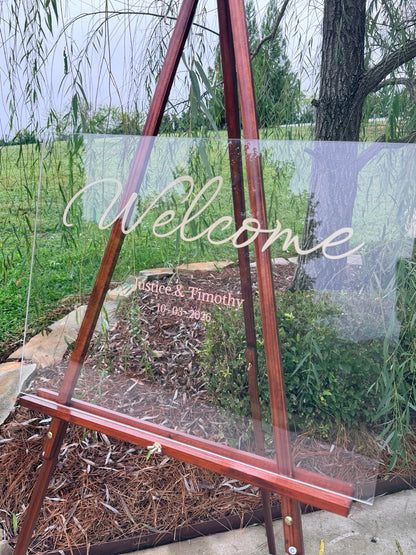 Angled view of custom clear acrylic wedding welcome sign