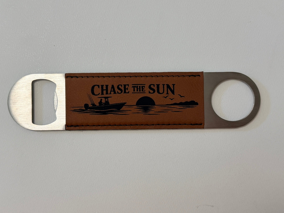 Beam & Blade premium leatherette magnetic bottle opener with engraved Chase the Sun boat design
