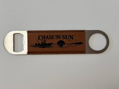 Beam & Blade premium leatherette magnetic bottle opener with engraved Chase the Sun boat design