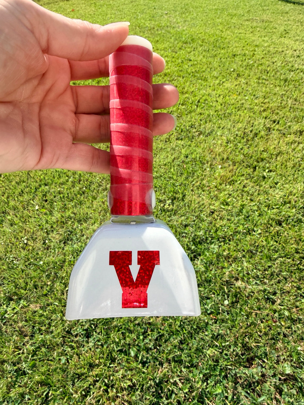 White school spirit cowbell with red glitter Y and red glitter wrapped handle